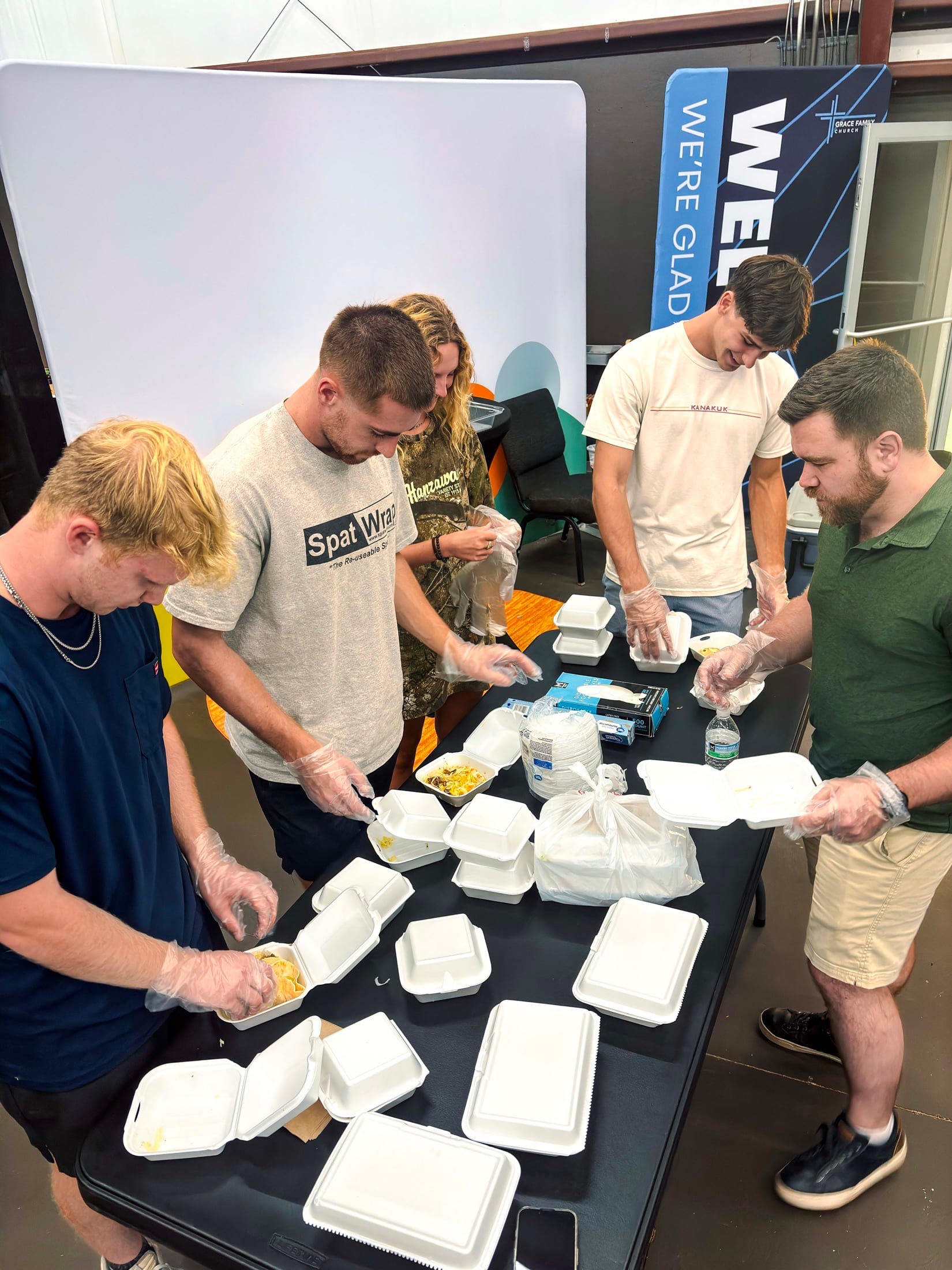 Hope Bridges volunteers preparing meals for outreach